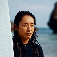 profile photo of a  woman surfing